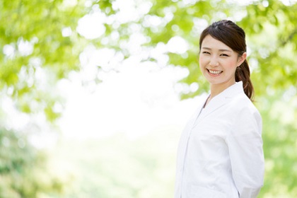 young asian doctor relaxing on green background